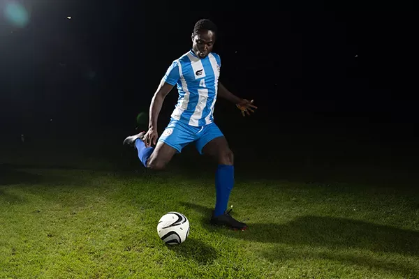 Professional MLS player kicks soccer ball